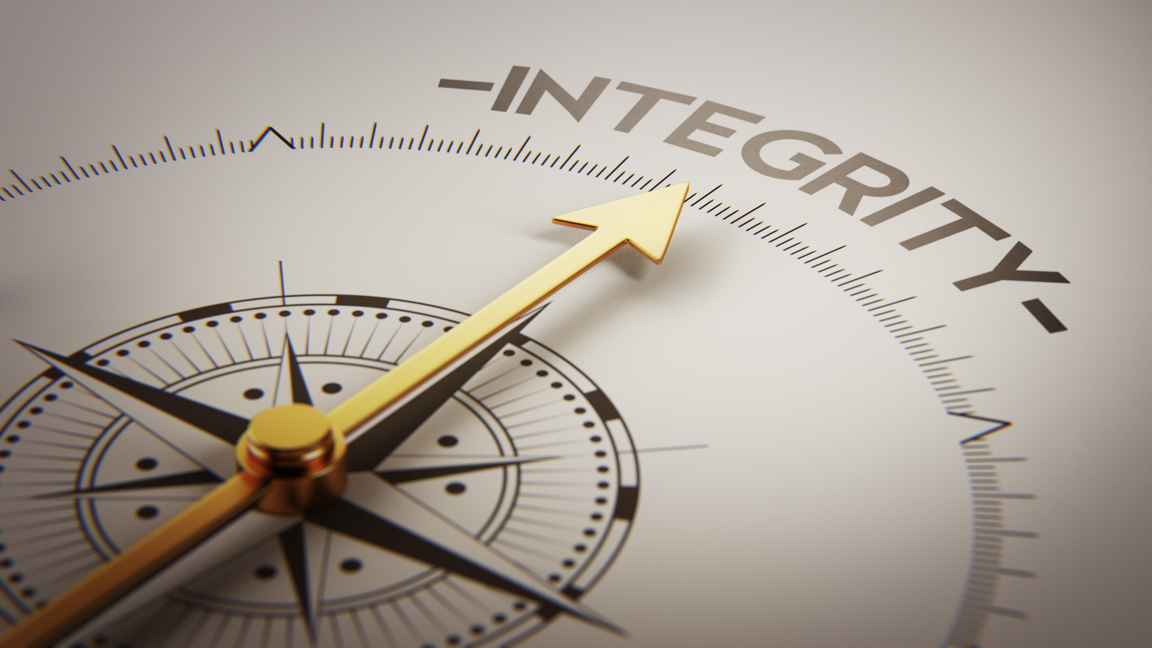 concept image of a compass pointing to the word 'integrity'