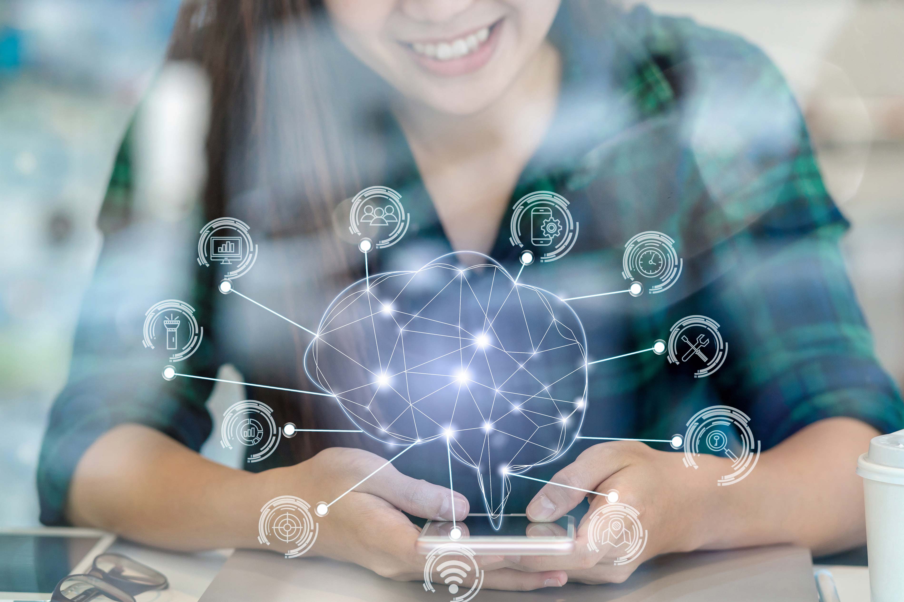 A smiling woman uses a smartphone with a digital brain graphic and various technology icons overlaid, representing connections and networked data.