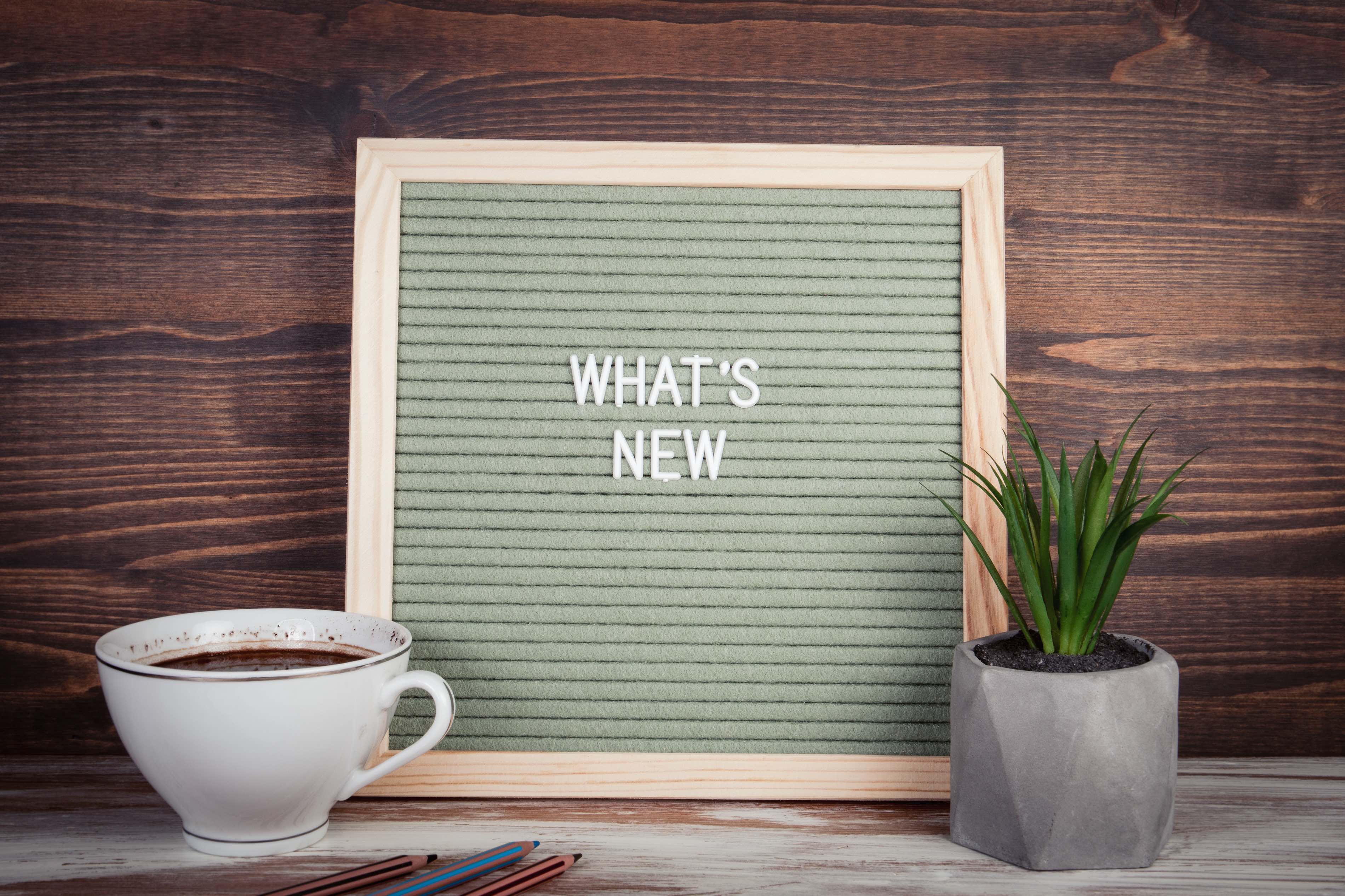Bulletin board with the words What's new written down