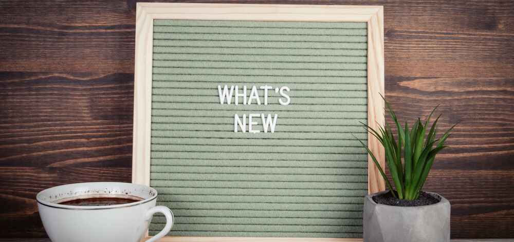 Bulletin board with the words What's new written down