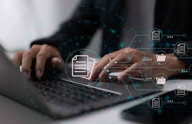 Graphic of a file system superimposed over a laptop.
