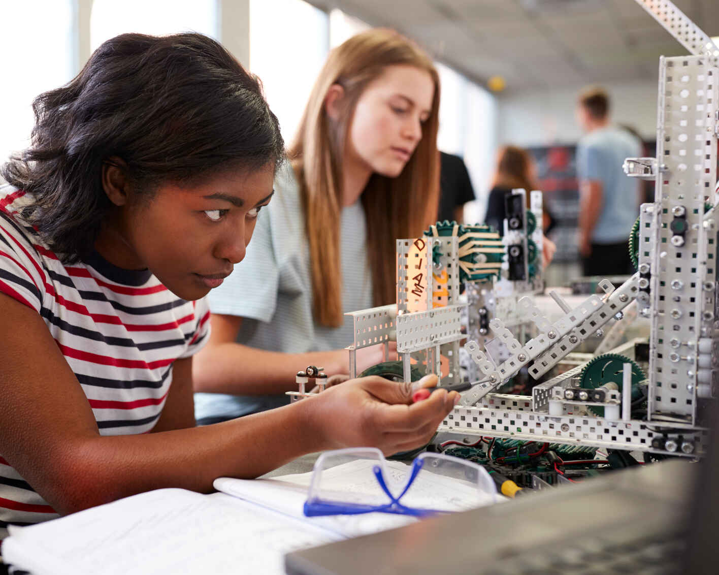 students working together to build a structure for an assignment