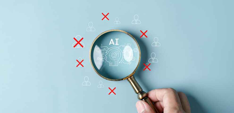 Image of a hand holding a magnifying glass over letters that spell AI