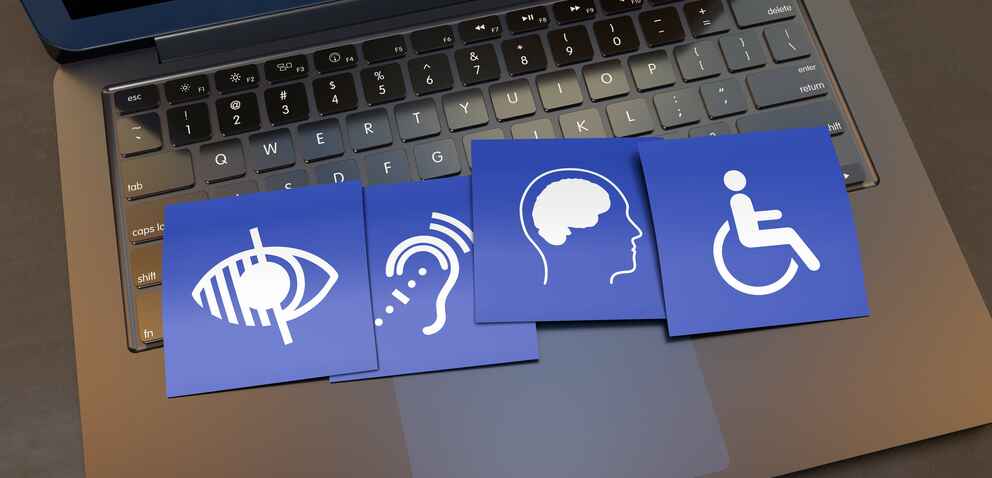 Disability signs overlaying a laptop